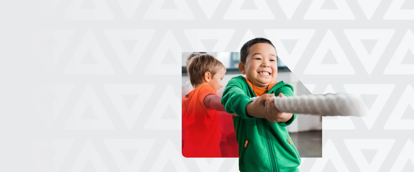 A kid wearing green bunny hug with a cute smile